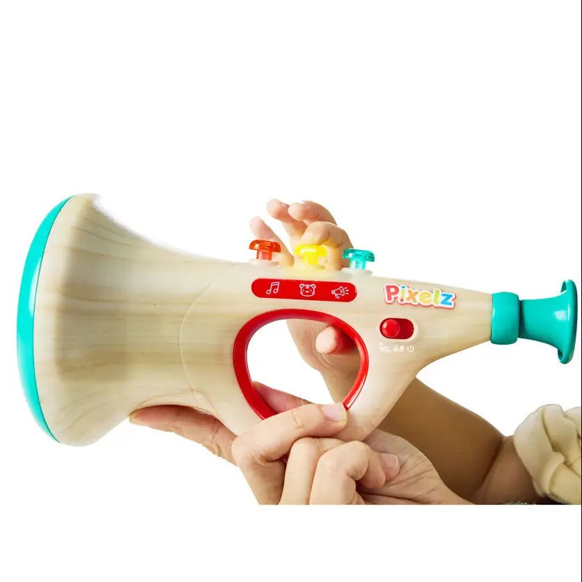 Child holding a colorful toy trumpet with wooden body and colorful accents on a white background