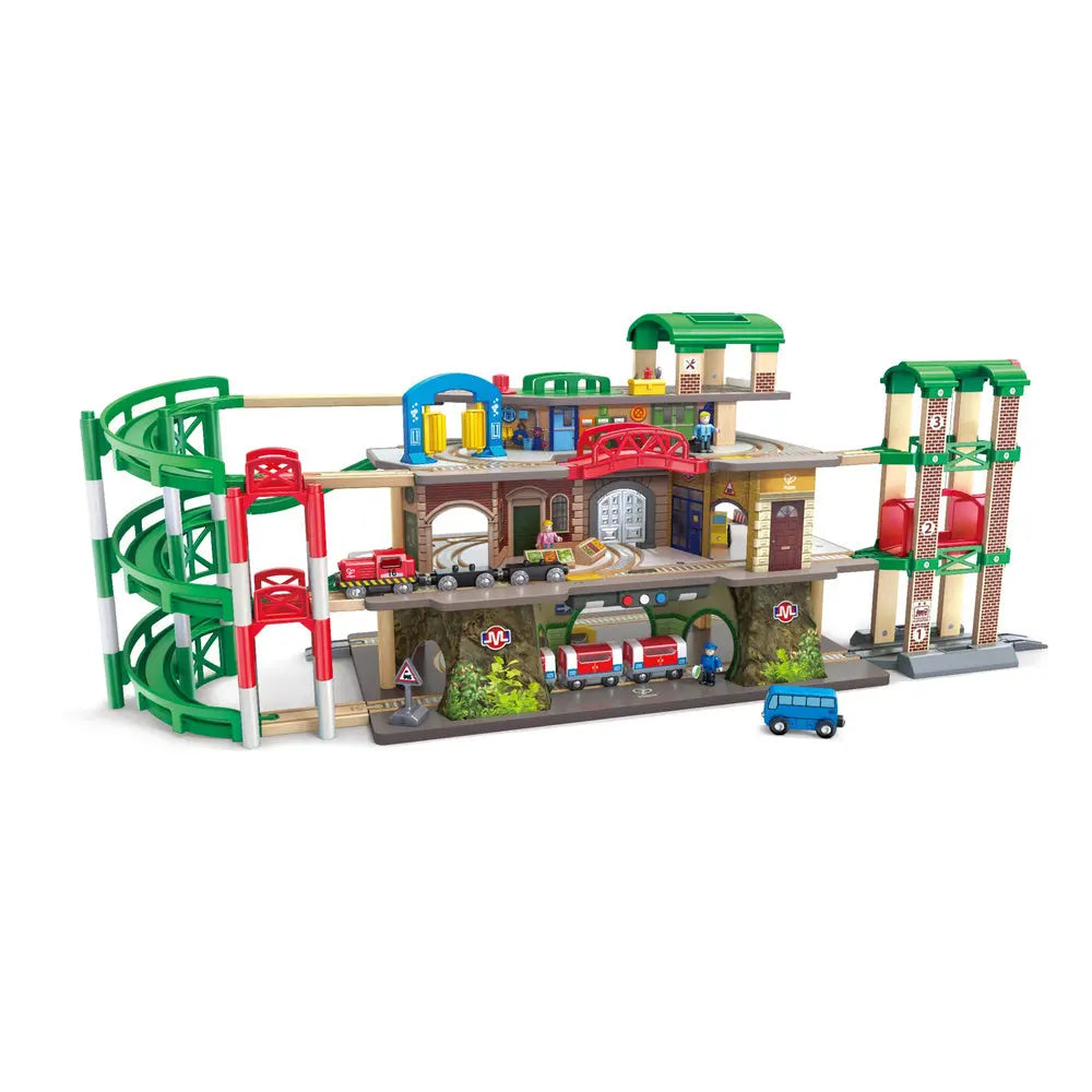 Hape E3883 four-story railway city set with spiral tracks, subway, trains and vehicles
